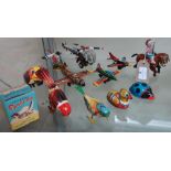 Friction powered tin plate aeroplanes and helicopters, a boxed clockwork sparrow, donkey boy and