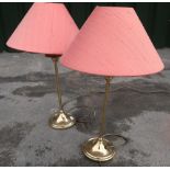 Pair of brass finish table lamps with salmon coloured conical shades. Lloyd loom bathroom white