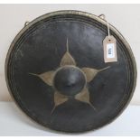 Indonesian circular brass gong, with raised central boss and gilt decoration (diameter 58cm)