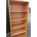 A beech laminate bookcase with five open shelves