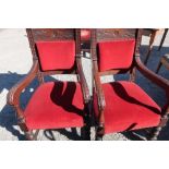 Pair of late Victorian oak heavy carved framed armchairs with upholstered seats and backs, with H