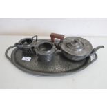 A Lion hammered pewter three piece tea service with Bakelite handle, on similar K&D oval pewter tray