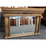 Regency style bevelled rectangular mirror plate in gilt frame with columns and scroll cresting (