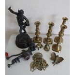 Spelter figure of a dancer, two pairs of Victorian brass candlesticks, horse brasses and other