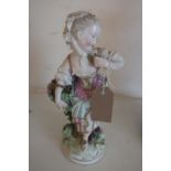 19th C Derby model of "Autumn" girl with fruit basket, by a tree stump (28cm high)