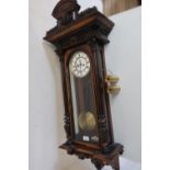 Victorian walnut and ebonised cased Vienna type wall clock, circular Roman dial and twin weight