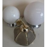 Three glass and brass wall light fittings, and a large opaque glass and chromed centre globe light