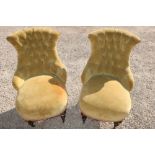 Pair of Victorian nursing chairs, with deep buttoned upholstered shaped backs, bow front seats, on