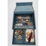 Blue leather cantilever jewellery box containing a qty. of costume jewellery incl. gold back and