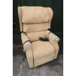 Dewert electric recliner with semi wing-back, upholstered in old gold floral patterned material
