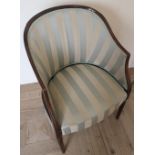Edwardian mahogany framed tub chair with tapering fluted supports, upholstered in Regency style