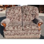 Two seat cottage style settee upholstered in mushroom floral patterned material