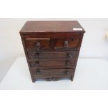 19th C oak apprentice miniature piece chest of two short above three long drawers, with carved apron