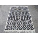20th C Tunisian wall rug, beige ground with all over geometric patterned pattern (315cm x 205cm)
