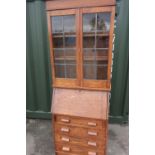 1930s bureau bookcase, two shelves enclosed by leaded glazed doors over fall front and four