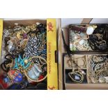 Two boxes of various assorted costume jewellery, watches, etc.