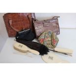 Two crocodile skin handbags, a parasol, a needlework covered bag with enamel clasp etc (one box)