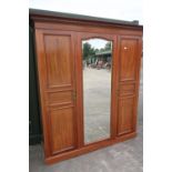 Edwardian mahogany inlaid wardrobe with central bevelled edge mirrored panel flanked by two panelled
