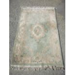 Green ground Chinese embossed woollen rug