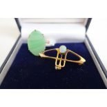 9ct gold Art Nouveau brooch set with an opal and pearl, stamped 9ct, and a ring with oval onyx