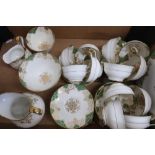 Staffordshire New Chelsea pattern tea service for twelve, decorated with green & gilt, by T