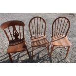 Pair of light elm Ercol stick back chairs and another country style elm chair (3)
