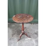 19th C elm and mahogany tripod wine table with circular top on turned column on splay legs