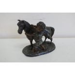 Spelter figure of a boy and pony on oval base (14.5cm high)