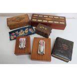 An inlaid mahogany and bone cribbage board, two vintage car models on teak boxes, an olive wood box,