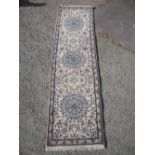 20th C Indo Persian design runner with three central rose design medallions on floral background (