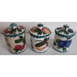 Three Wemyss Pottery preserve jars with lift off lids, decorated with plums and apples (approx