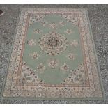 Asmara acrylic green ground rug with floral border (195cm x 140cm)