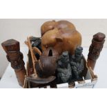Two pairs of hardwood carved elephants, two carved wooden figures, Eastern ladle, skimmer and two