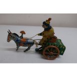 Lehman style clockwork tinplate model of a clown driving a donkey cart