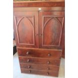 Victorian mahogany linen press, moulded cornice above two Gothic arch moulded doors and four long