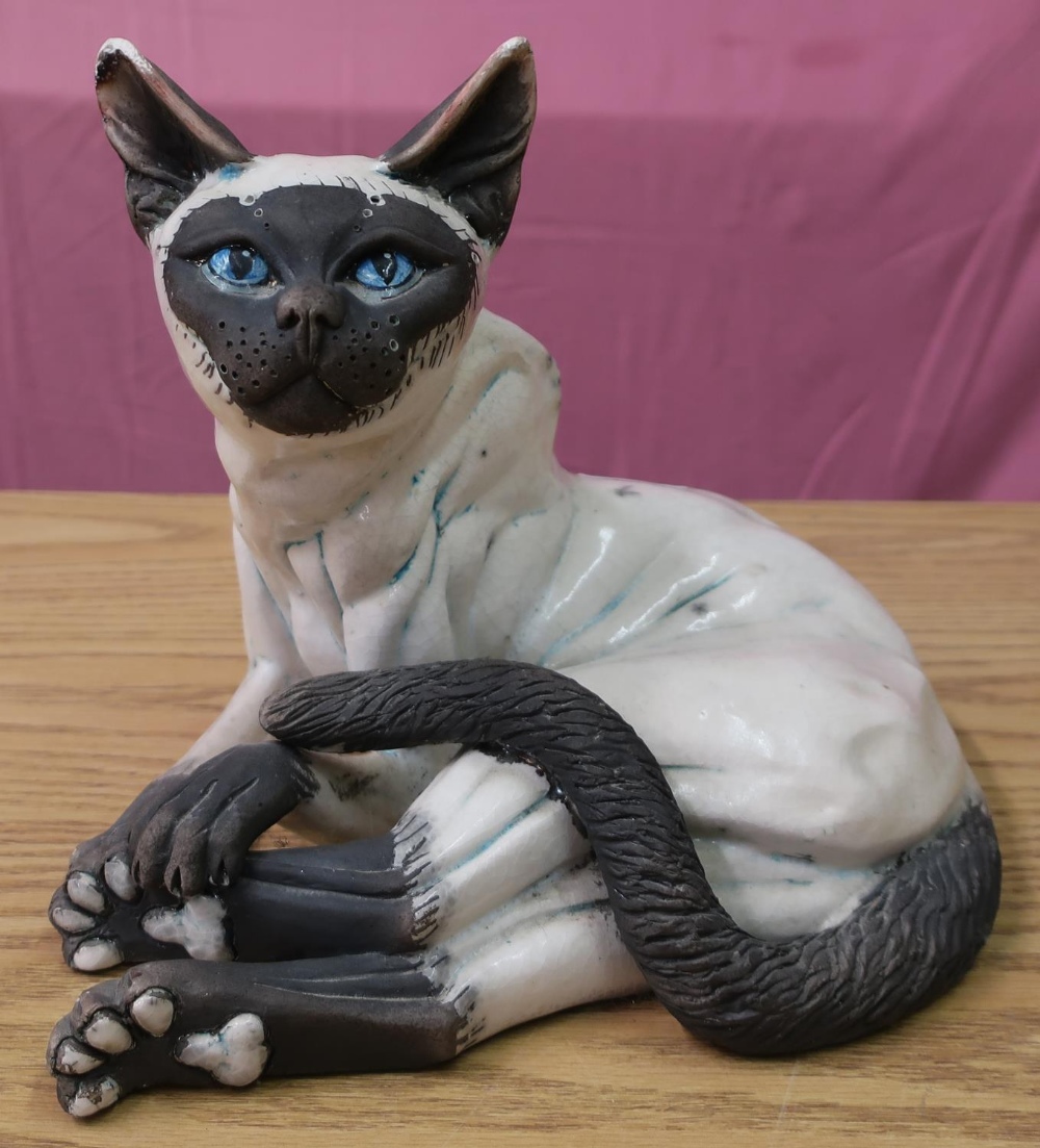 Raku ware style figure of a seated Siamese cat in crackle glaze finish (height 25cm)