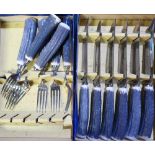 Boxed set of Sheffield Stainless Steel and antler handled set of six steak knives & forks