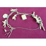 9ct gold hallmarked charm bracelet, hung with ten charms (21 grams)