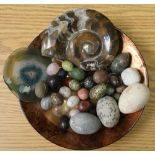 Studio glass bowl containing a selection of various stone and polished gemstones "eggs", polished