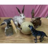Two studio ceramic hares, Imago figure of a wolf, large ceramic egg, and carved stoneware bird