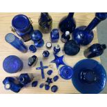 Large selection of blue glassware, including bottle storage jars, etc