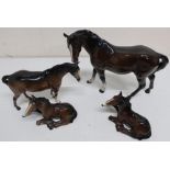 Four Beswick models of horses, two standing, two sitting (4)