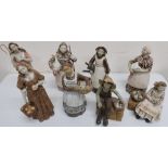 Group of eight studio pottery figures of various countryside ladies, carrying produce, including a