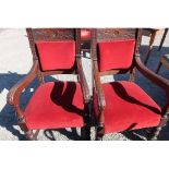 Pair of late Victorian oak heavy carved framed armchairs with upholstered seats and backs