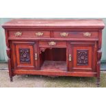 Late Victorian mahogany sideboard with two drawers above carved and panelled doors (width 153cm)