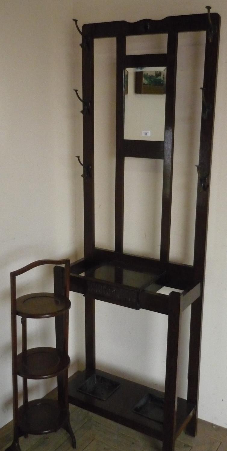 20th C oak hall stand, with bevelled mirror above a hinged compartment, with two drip trays (184cm x
