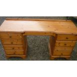 Pine ducal twin pedestal dressing table with four drawers to each pedestal