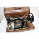 Early 20th C cased Singer hand sewing machine, black with gilt scroll detail no. Y1096259