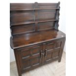 Ercol dresser, twin shelf, low back, above two four panelled doors (122cm x 152cm x 46cm)