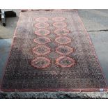 Hand knotted woolen Bokhara pattern rug, approx 200cm x 124cm
